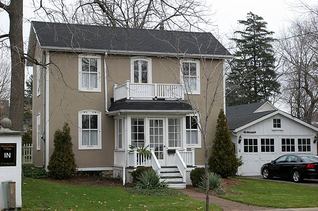 Two story house with green lawn in front
