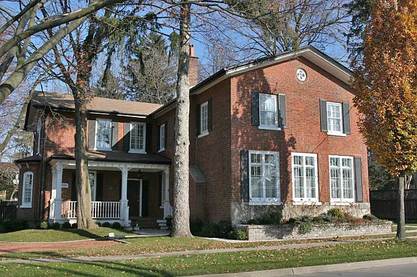 Large house red brick two stories sunny weather