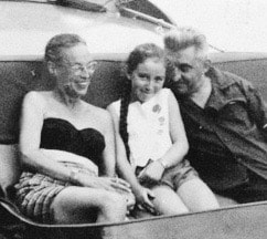 Vintage photo of a man and woman with a young girl sitting between them